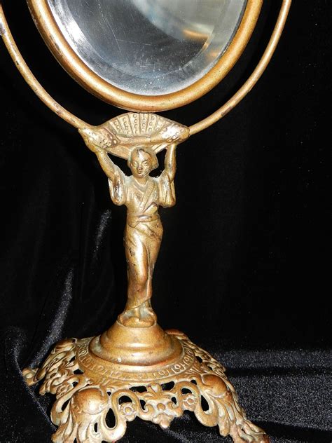 antique cast iron vanity mirror with geisha girl base from