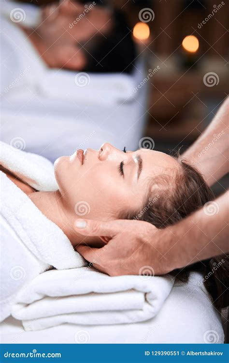 Beautiful Young Woman Receiving Massage On Head And Shoulders Zone In