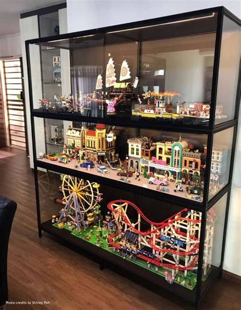 display case filled  lots  toy cars  buildings  top