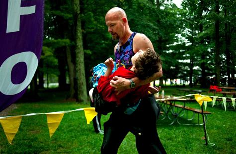 Dad Runs Triathlon While Carrying Daughter Suffering From