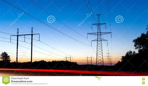 pylons  electricity power lines  night  traffic lights stock photo image  cable