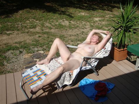 sue sunbathing and masturbating outside 16 pics