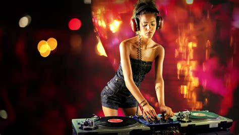 A Sexy Female Dj Dancing Topless And Playing Records Stock