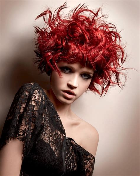 messy looking red curly hairstyle with blunt bangs