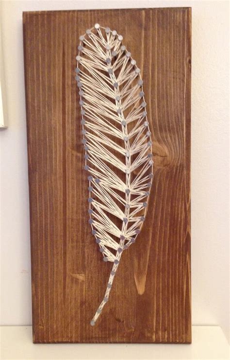 items similar  feather string art  etsy