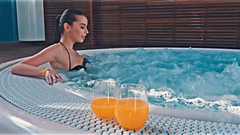 spa resort jacuzzi hot tub woman happy woman relaxing in jacuzzi woman in spa salon stock