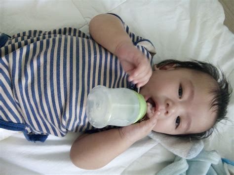 ayan tryin  hold  bottle ah jas cis flickr