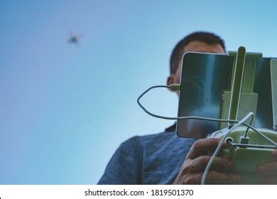 young man flying drone  sunny stock photo  shutterstock