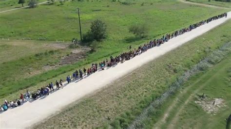 drone footage shows steady stream  migrants entering texas  title  expiration