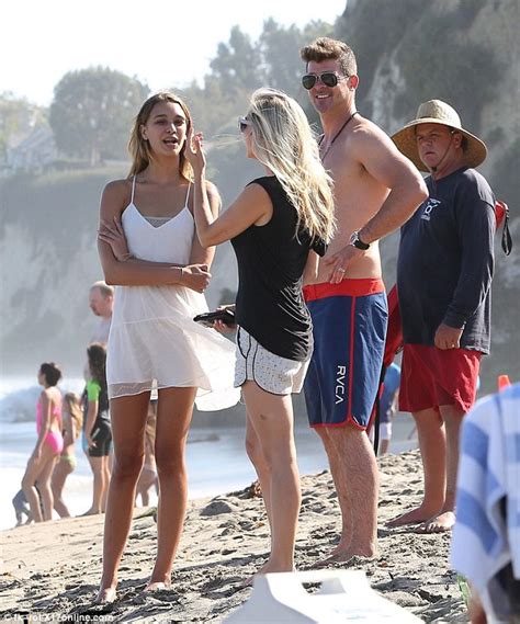 shirtless robin thicke hits the waves with son julian and