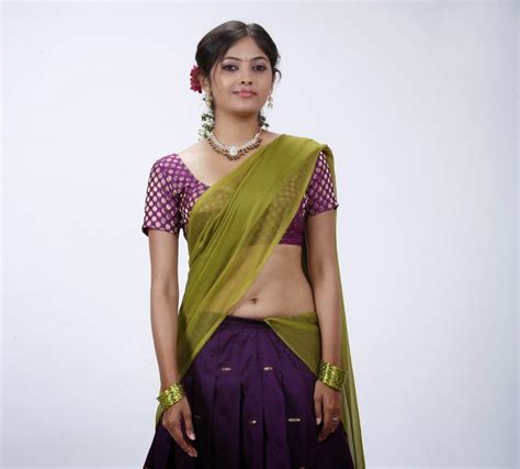 south indian hot vilalge girl supoorna sexy half saree pallu dropping exposing bulging navel