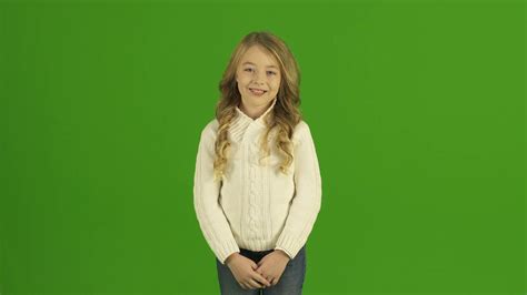 The Cute Girl Smile On The Green Background Stock Video Footage