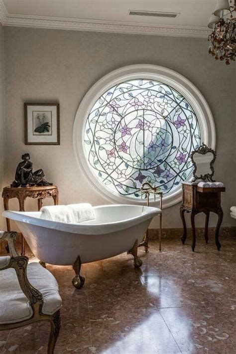 bathroom with large round stained glass window french interior design