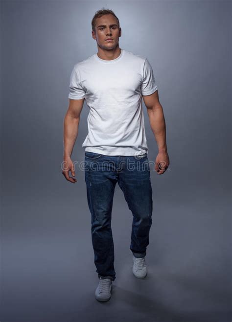 fashion model posing in jeans and white t shirt stock