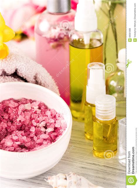 spa setting  pink roses  aroma oil vintage style stock photo