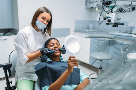 female patient whitening procedure dental clinic stock