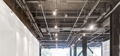 exposed ceiling showing lighting grid  ductwork
