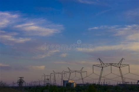 silhouette of high voltage power plant and transformation station at sunset stock image image