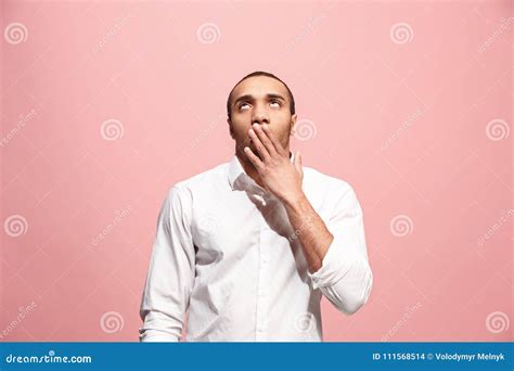 beautiful bored man bored  pink background stock photo image  handsome face