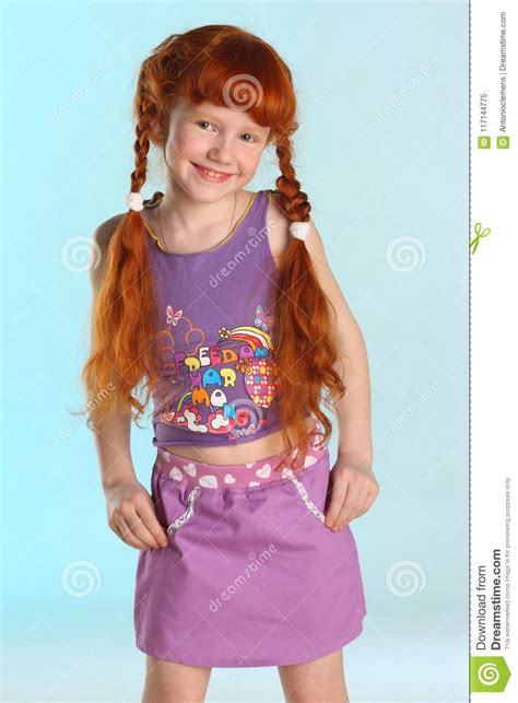 portrait of little redhead pre teen fashion girl model in