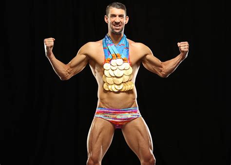 michael phelps poses with all his gold medals