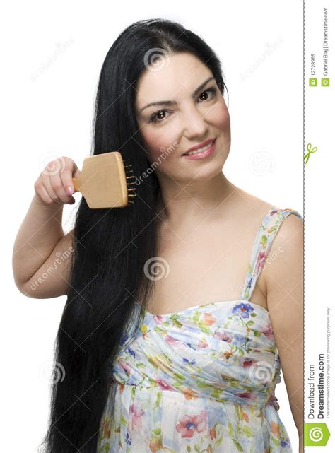 woman brushing her long black hair royalty free stock