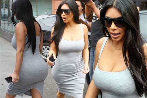 pregnant kim kardashian squeezes into eye watering grey dress as she