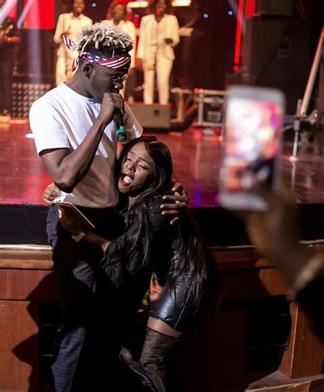 Lady Grabs Mr Eazi By His Waist And Moans Photo