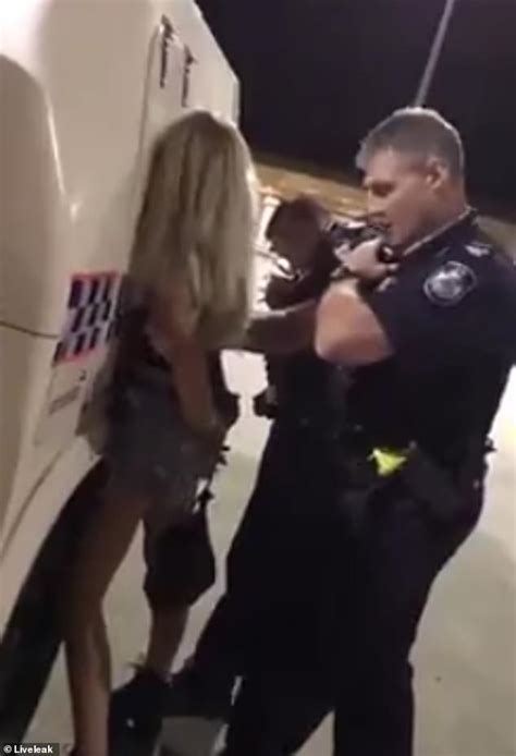officer slams tiny blonde woman into a police van and pins her to the