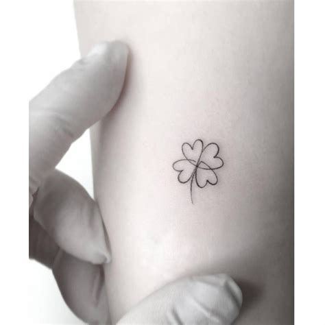 small  leaf clover tattoo   left side    arm  wrist
