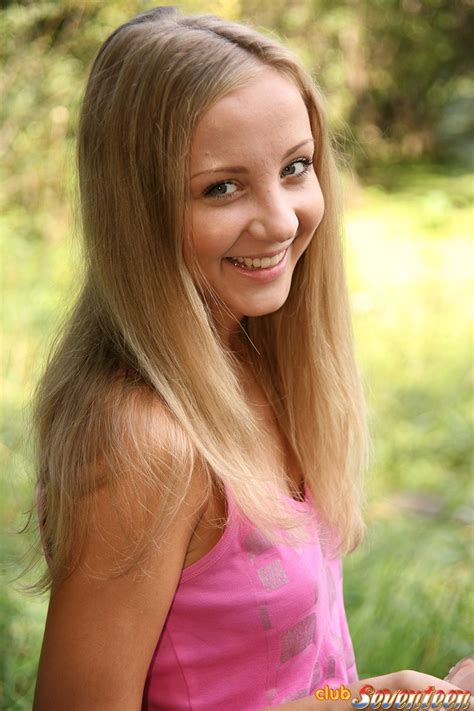 a beautiful teenage babe standing naked on a boat