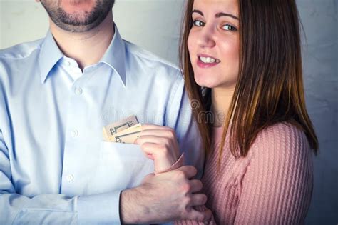 Woman Demanding Money From Her Husband Who Is Showing Empty Pockets