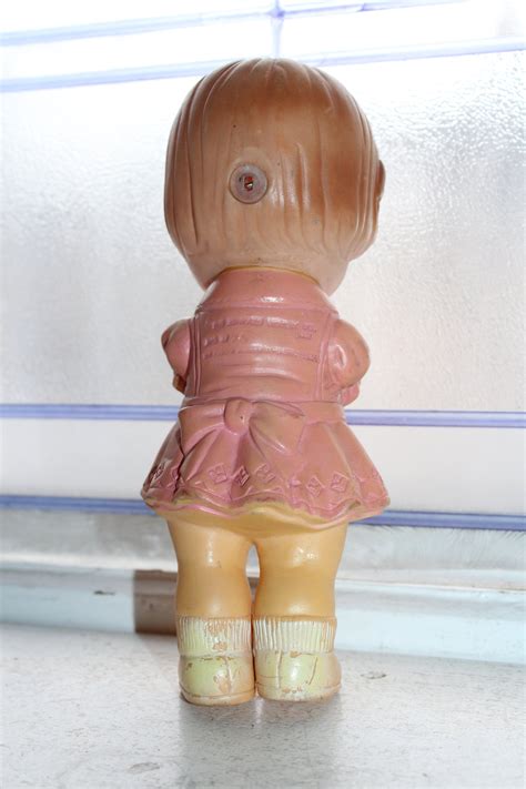 vintage squeaker toy rubber doll circa