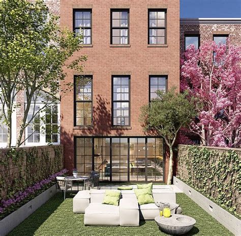 outdoor seating area  front   brick building  trees  flowers   lawn