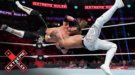 aj styles plants ricochet with a vicious brainbuster wwe extreme rules