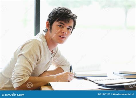 handsome student writing  paper stock image image  read learning