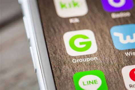 drop  groupon shares   announces   stop selling physical goods latest retail