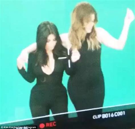 mamma mia kourtney kardashian cradles bump at photo shoot while kim