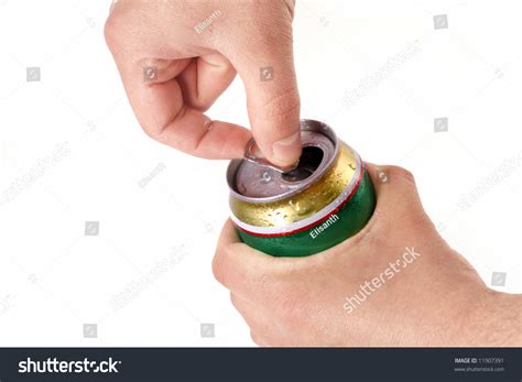 mans hand opening aluminum beer  isolated  white background