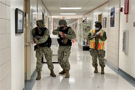 Navy Security Forces Perform A Sweep Of A Building During An Active