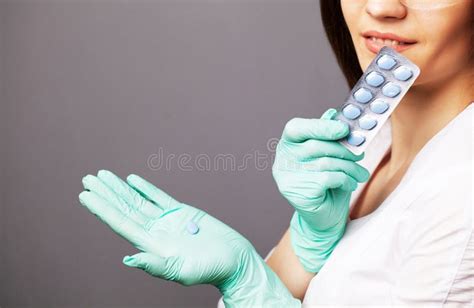 Sexual Health A Doctor In A White Coat Holding A Pill For A Healthy