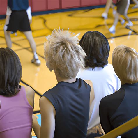 Four Thirtysomething Lesbians On Bleachers In A Gymnasium Watching A