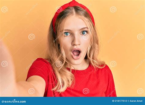 Beautiful Young Caucasian Girl Taking A Selfie Photo Scared And Amazed