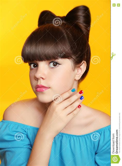 beautiful smiling teen girl with bow hairstyle makeup and