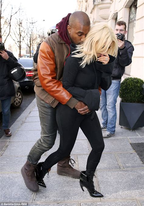 kim kardashian gets the giggles as over amorous kanye west makes a grab for her famous derriere