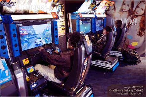 photo  people playing  arcade  japan stock image mxi