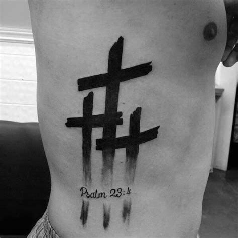 A Man With A Cross Tattoo On His Stomach And The Words Paul 29 1
