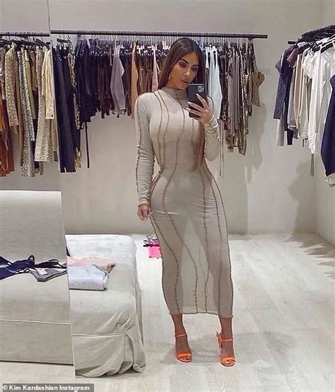 Kim Kardashian Models Skintight Sheer Dress And Prada Flame Wedges In