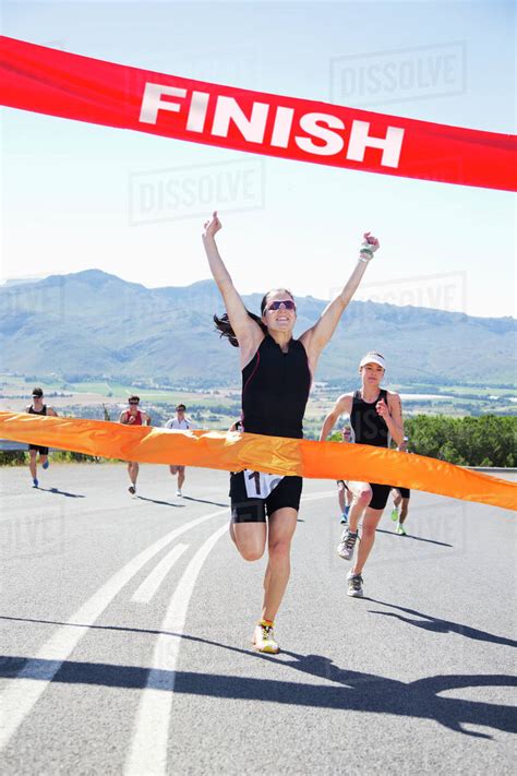 runner crossing race finish  stock photo dissolve