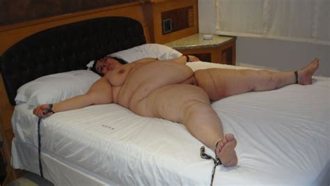 my submissive bbw is naked and spreadeagle tied in a bed again bbw fuck pic